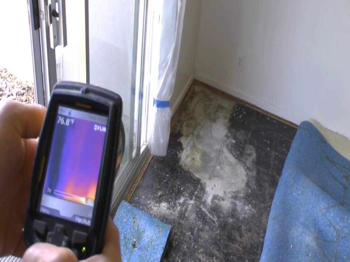 Thermal imaging camera showing a moisture pattern from a hidden slab leak under flooring in a Torrance home